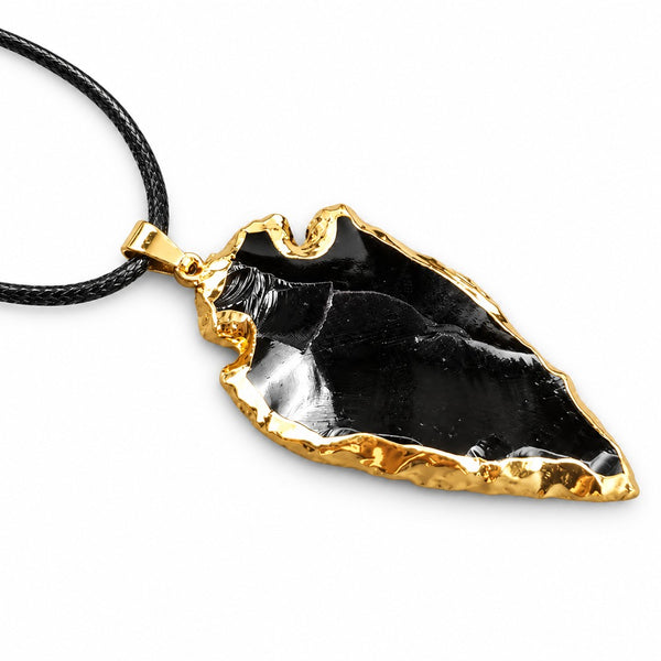 Obsidian arrowhead pendant with gold-tone edge on black cord — VoxArcana