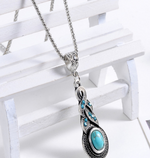 Blue teardrop pendant necklace with a turquoise-look stone, antique silver tone — VoxArcana