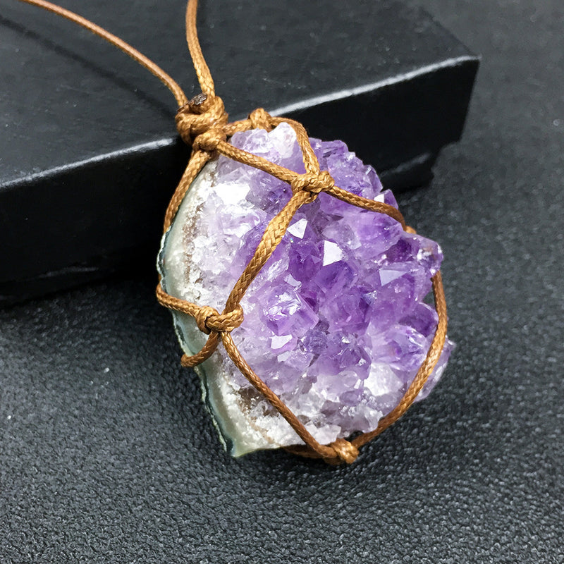 Rough amethyst cluster pendant in a brown cord net — VoxArcana