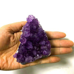 Amethyst cluster piece in the hand, sold by weight 10 to 20 g — VoxArcana