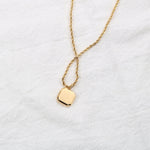 Black onyx-look square pendant on a gold-tone rope chain — VoxArcana