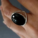 Black oval stone ring, open-work band, silver tone, size 6 — VoxArcana