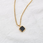 Black onyx-look square pendant on a gold-tone rope chain — VoxArcana