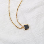 Black onyx-look square pendant on a gold-tone rope chain — VoxArcana