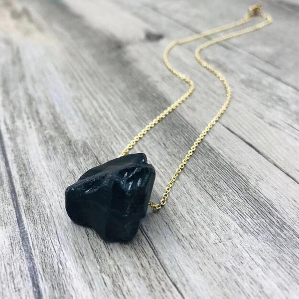 Raw black stone pendant necklace on a gold-tone chain — VoxArcana